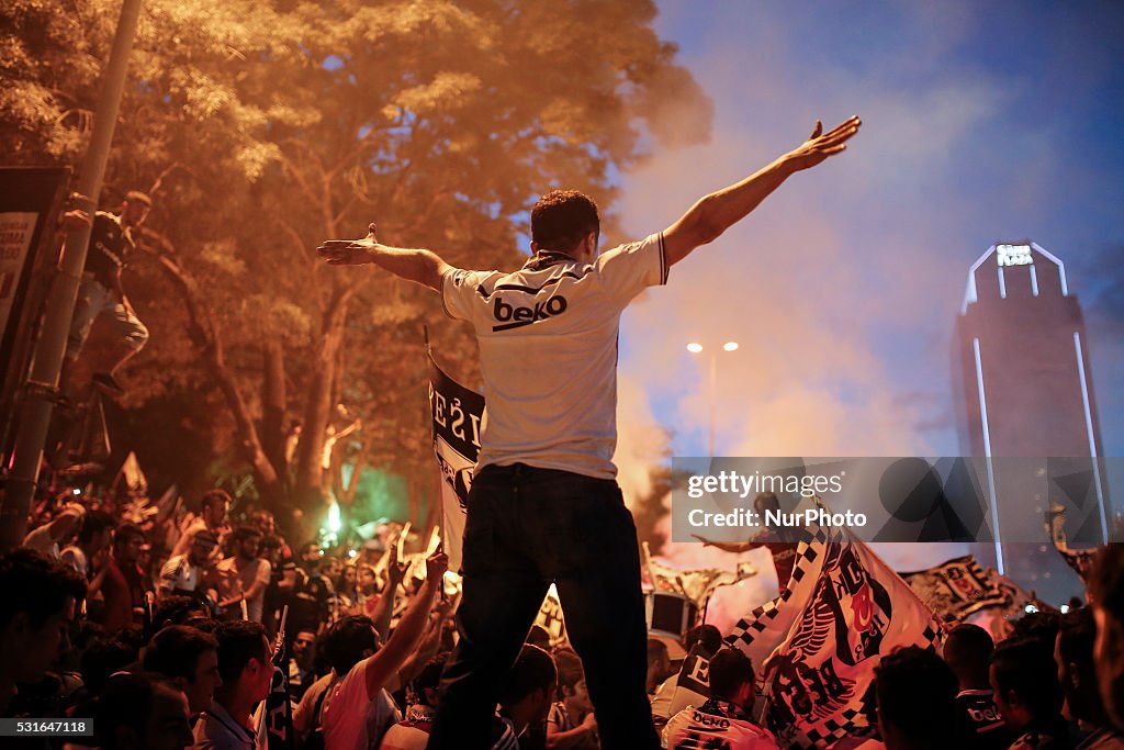 Besiktas' supporters celebrate the win the Turkish Super Toto league football