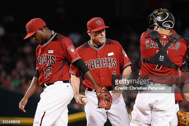 Manager Chip Hale of the Arizona Diamondbacks takes the baseball from starting pitcher Rubby De La Rosa as he is removed during the seventh inning of...