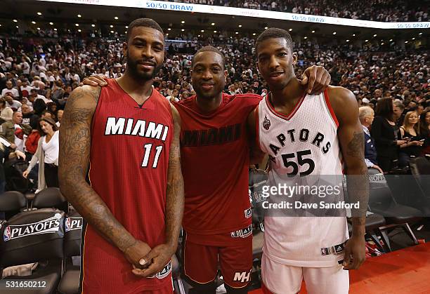 Dwyane Wade of the Miami Heat poses with brothers Dorell Wright of the Miami Heat and Delon Wright of the Toronto Raptors during Game Seven of the...