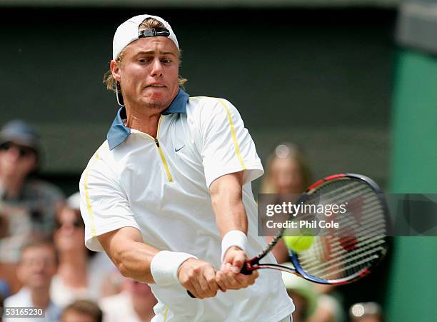 Lleyton Hewitt of Australia in action against Feliciano Lopez of Spain in the Gentlemen?s Singles during the ninth day of the Wimbledon Lawn Tennis...