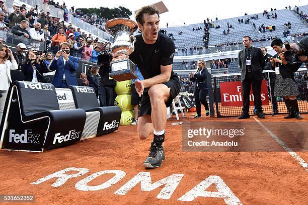 Andy Murray of Great Britain poses with his trophy after winning the Men's Singles Final match against Novak Djokovic during day eight of The...