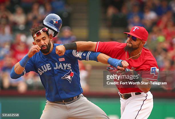 Toronto Blue Jays Jose Bautista gets hit by Texas Rangers second baseman Rougned Odor after Bautista slid into second in the 8th inning at Globe Life...