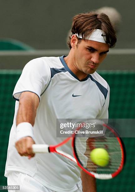 Roger Federer of Switzerland in action against against Fernando Gonzalez of Chile in the Gentlemen?s Singles during the ninth day of the Wimbledon...