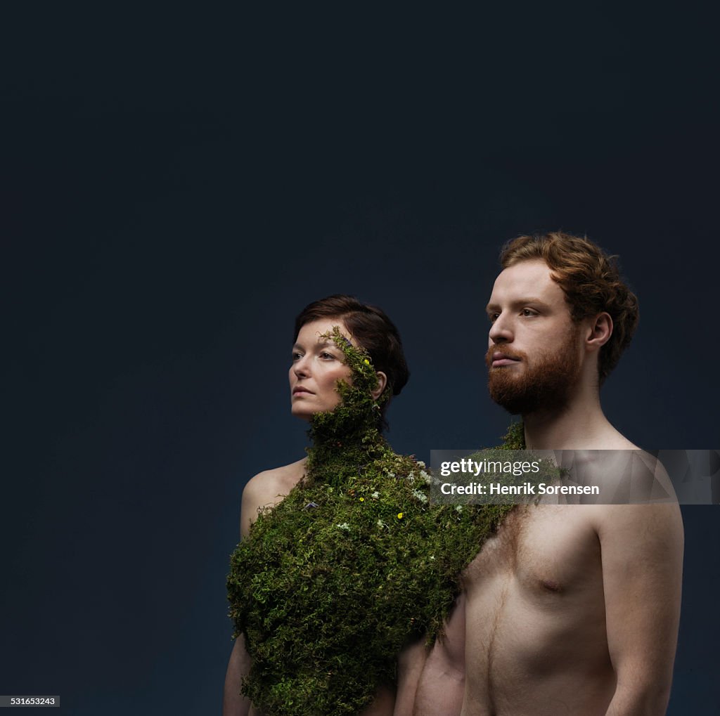 Couple with moss growing on torsoes