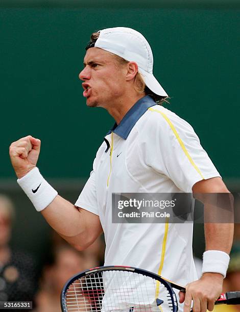 Lleyton Hewitt of Australia celebrates winning a game against Feliciano Lopez of Spain in the Gentlemen?s Singles during the ninth day of the...