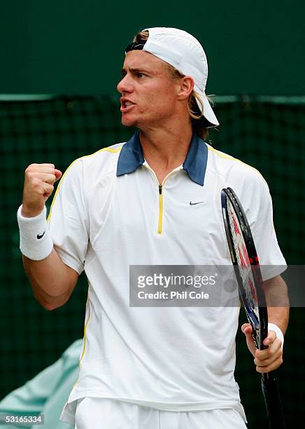 Lleyton Hewitt of Australia celebrates winning a game against Feliciano Lopez of Spain in the Gentlemen?s Singles during the ninth day of the...