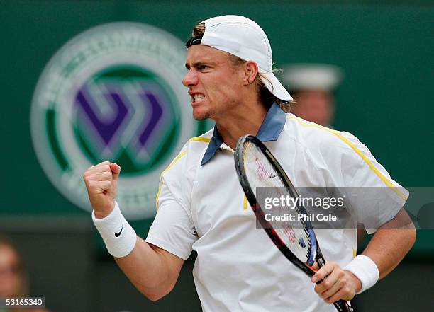 Lleyton Hewitt of Australia celebrates winning a game against Feliciano Lopez of Spain in the Gentlemen?s Singles during the ninth day of the...