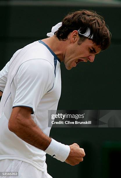 Roger Federer of Switzerland celebrates winning a game against Fernando Gonzalez of Chile in the Gentlemen?s Singles during the ninth day of the...