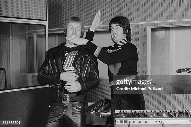 Drummer Geoff Britton and singer/bassist Paul McCartney, of British rock group Wings, at Abbey Road Studios to record the album, 'Venus And Mars',...