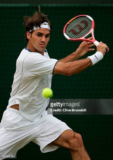 Roger Federer of Switzerland in action against against Fernando Gonzalez of Chile in the Gentlemen?s Singles during the ninth day of the Wimbledon...