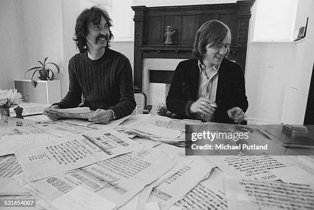 English drummer Nick Mason of rock group Pink Floyd, with music journalist Steve Peacock of Sounds magazine, 30th October 1974. They are sitting at a...