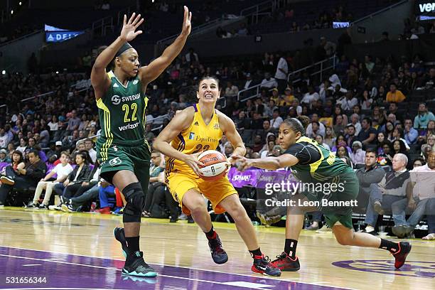 Ana Dabovic of the Los Angeles Sparks handles the ball against Monica Wright of the Seattle Storm during a WNBA basketball game at Staples Center on...