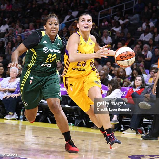 Ana Dabovic of the Los Angeles Sparks handles the ball against Kaleena Mosqueda-Lewis of the Seattle Storm during a WNBA basketball game at Staples...
