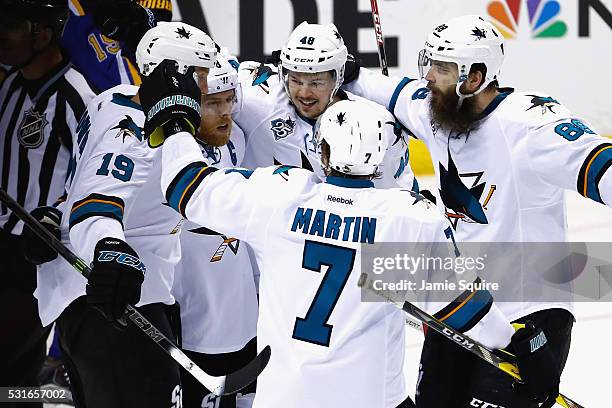 Joe Pavelski of the San Jose Sharks celebrates with teammates after scoring a first period goal against Brian Elliott of the St. Louis Blues in Game...