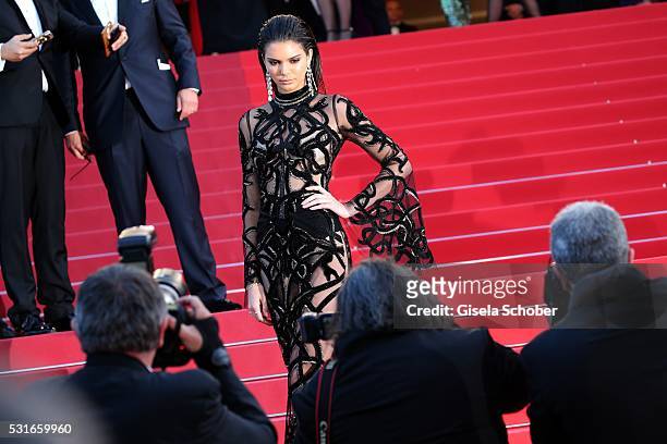 Kendall Jenner in front photographers during the "From The Land Of The Moon " premiere during the 69th annual Cannes Film Festival at the Palais des...