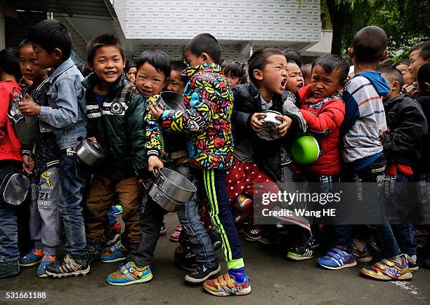 Students queue for free lunch at Yuanbao school of Longli country on May 13 in Guizhou, China. Guizhou is a mountainous province located in the...