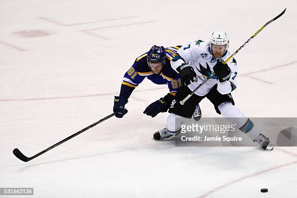 Vladimir Tarasenko of the St. Louis Blues battles for the puck with Paul Martin of the San Jose Sharks during the third period in Game One of the...