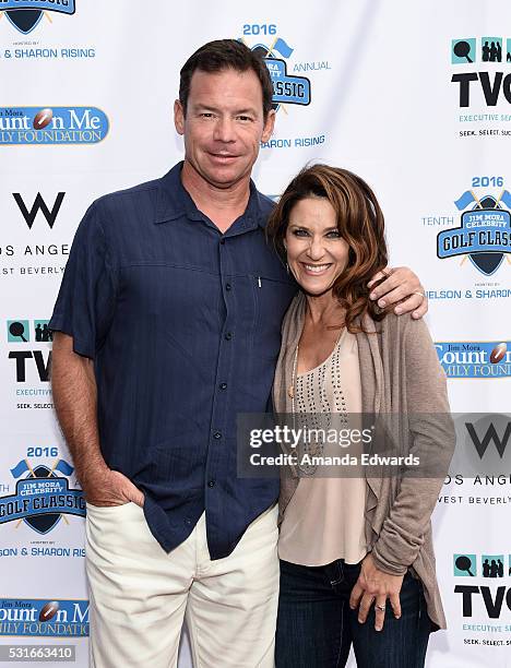 Football coach Jim Mora and his wife Shannon Mora arrive at the VIP celebrity cocktail reception for the 10th Annual Jim Mora Celebrity Golf Classic...