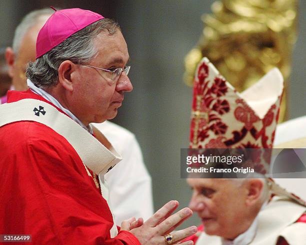 Archbishop of San Antonio Jos? Horacio Gomez leaves Pope Benedict XVI who bestowed on him the pallium, a woolen shawl, during the Solemnity of St...