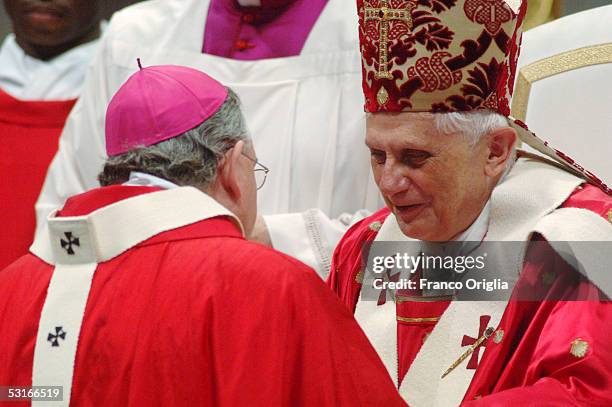 Pope Benedict XVI greets Archbishop of San Antonio Jos? Horacio Gomez after receiving the Pallium, a woolen shawl, during the Solemnity of St Peter...