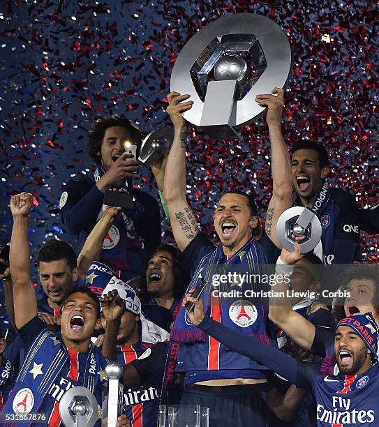 Zlatan Ibrahimovic of PSG lifts the trophy after the French Ligue betwee Paris Saint Germain and FC Nantes at Parc des Princes on May 14, 2016 in...