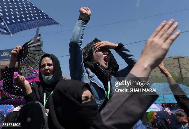 Afghan protesters chant anti-government slogans during a demonstration in Kabul on May 16 held to demand that The...