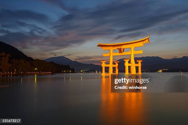 itsukushima shinto shrine on miyajima in japan - torii gate stock pictures, royalty-free photos & images