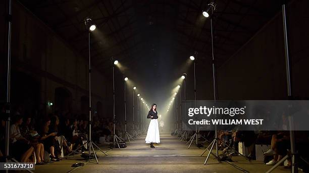 Model parades a creation from Australian label Aje during a showing of their new collection at Fashion Week Australia in Sydney on May 16, 2016. /...