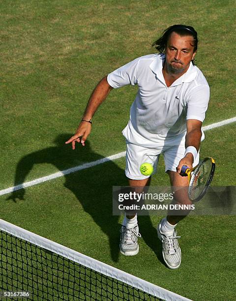 United Kingdom: Henri Leconte of France hits a shot during his senior doubles match with Anders Jarryd of Sweden as they play Javier Frana of...