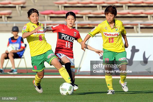 Hanae Shibata of Urawa Red Diamonds competes for the ball against Yuka Anzai and Kozue Setoguchi of JEF United Chiba during the Nadeshiko League...