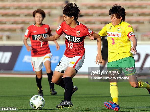Akari Shiraki of Urawa Red Diamonds and Naoko Sakuramoto of JEF United Chiba compete for the ball during the Nadeshiko League match between Urawa Red...