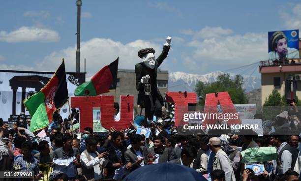 Afghan protesters chant anti-government slogans during a demonstration in Kabul on May 16 held to demand that The...