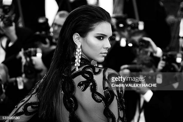 Model Kendall Jenner poses as she arrives on May 15, 2016 for the screening of the film "Mal de Pierres " at the 69th Cannes Film Festival in Cannes,...