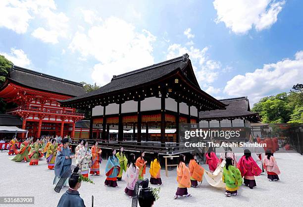 The 'Saio-dai' queen, principle figure of festival wearing a 12-layered ceremonial kimono of Heian Period court ladies called Junihitoe, arrives at...