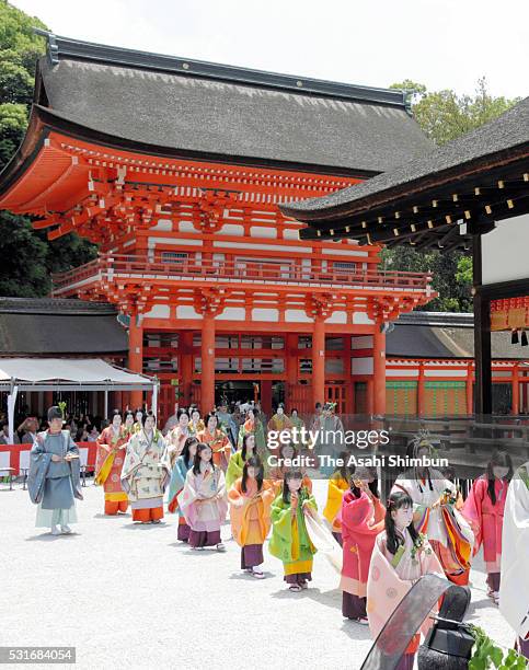 The 'Saio-dai' queen, principle figure of festival wearing a 12-layered ceremonial kimono of Heian Period court ladies called Junihitoe, arrives at...