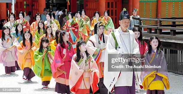 The 'Saio-dai' queen, principle figure of festival wearing a 12-layered ceremonial kimono of Heian Period court ladies called Junihitoe, arrives at...