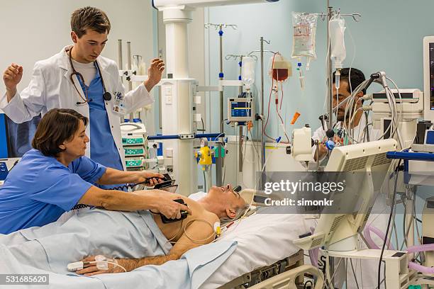 doctors and nurse in operating theatre - ventilator bildbanksfoton och bilder