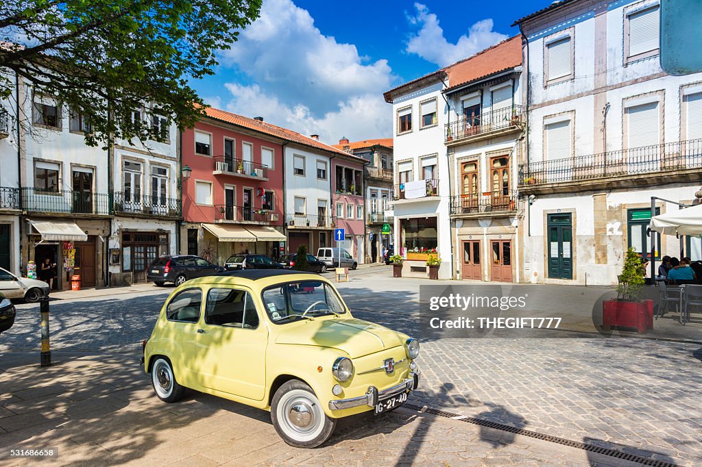 Old yellow fiat 500 fully restored in Ponte de Lima