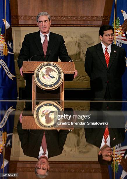 Director Robert Muller Attorney General Alberto Gonzales hold a press conference at the Department of Justice June 29, 2005 in Washington, DC. The...