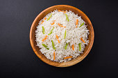 cooked white basmati rice with carrot and capsicum toppings