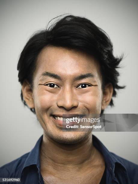 portrait of a young japanese man looking at camera - cheesy grin stock pictures, royalty-free photos & images