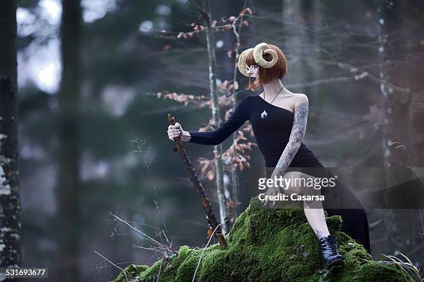 aries woman portrait in the wild woods - ram stockfoto's en -beelden