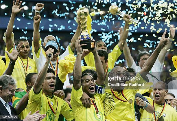 Ronaldinho captain of Brazil lifts the trophy following the FIFA 2005 Confederations Cup Final between Brazil and Argentina at the Waldstadion on...