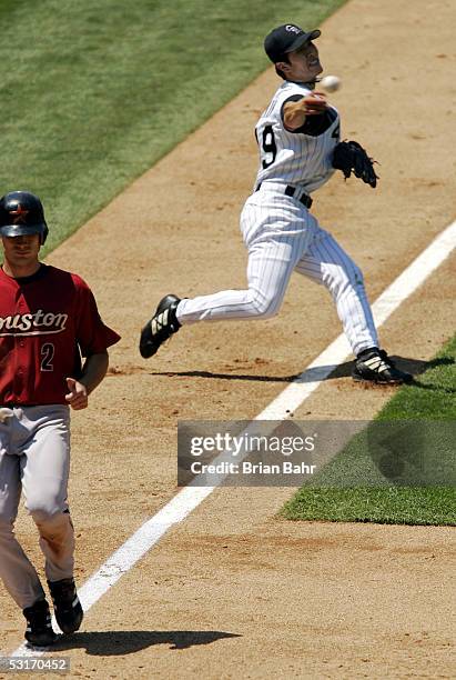 Byung-Hyun Kim of the Colorado Rockies throws too late on a bunt by Willy Taveras of the Houston Astros allowing Chris Burke to score with two outs...