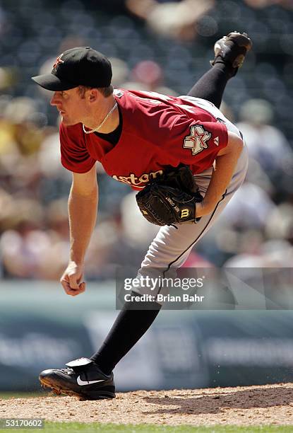 Starting pitcher Roy Oswalt of the Houston Astros follows through on his pitch against the Colorado Rockies on June 29, 2005 at Coors Field in...
