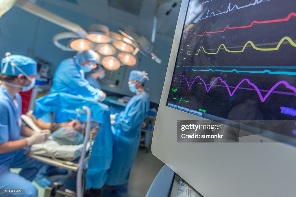 Surgeon and patient in operating theatre