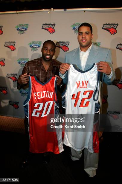 Raymond Felton and Sean May of the Charlotte Bobcats hold up their new jerseys during a press conference on June 29, 2005 at the Presbyterian...
