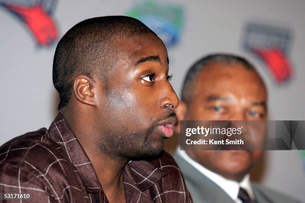 Raymond Felton of the Charlotte Bobcats talks during a press conference as general manager and head coach Bernie Bickerstaff watches on June 29, 2005...