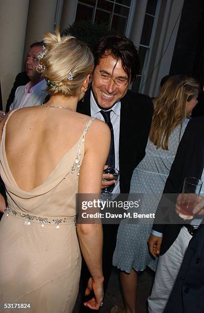 Emily Crompton and Bryan Ferry attend the annual Tatler Summer Party hosted by Gregg and also celebrating the publication of their "August 100 Most...