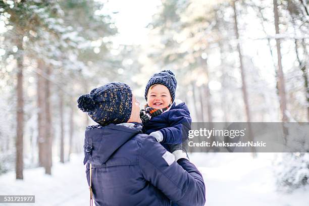 winter joy - dad and baby stock pictures, royalty-free photos & images